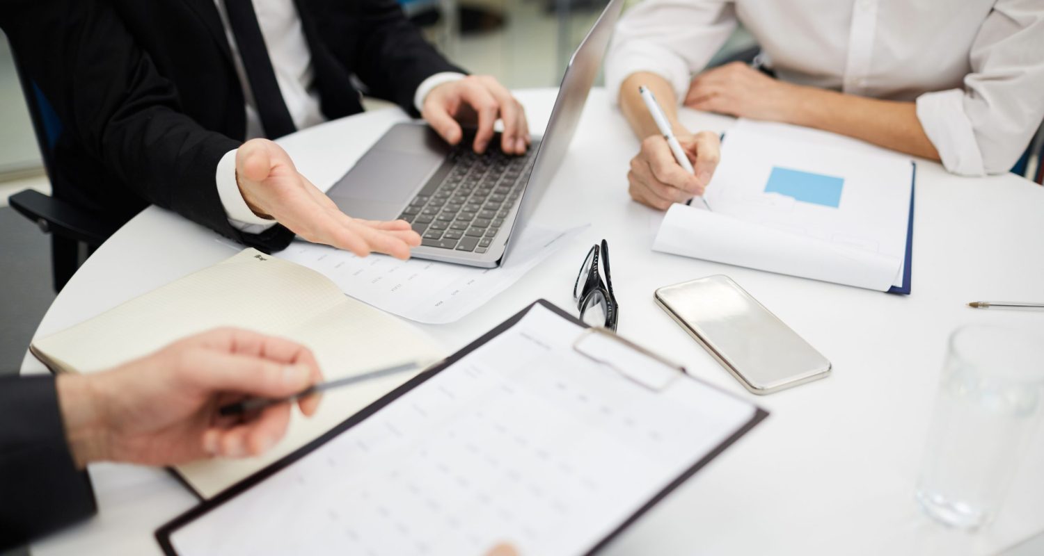 High angle closeup of unrecognizable business people discussing deal during meeting, copy space